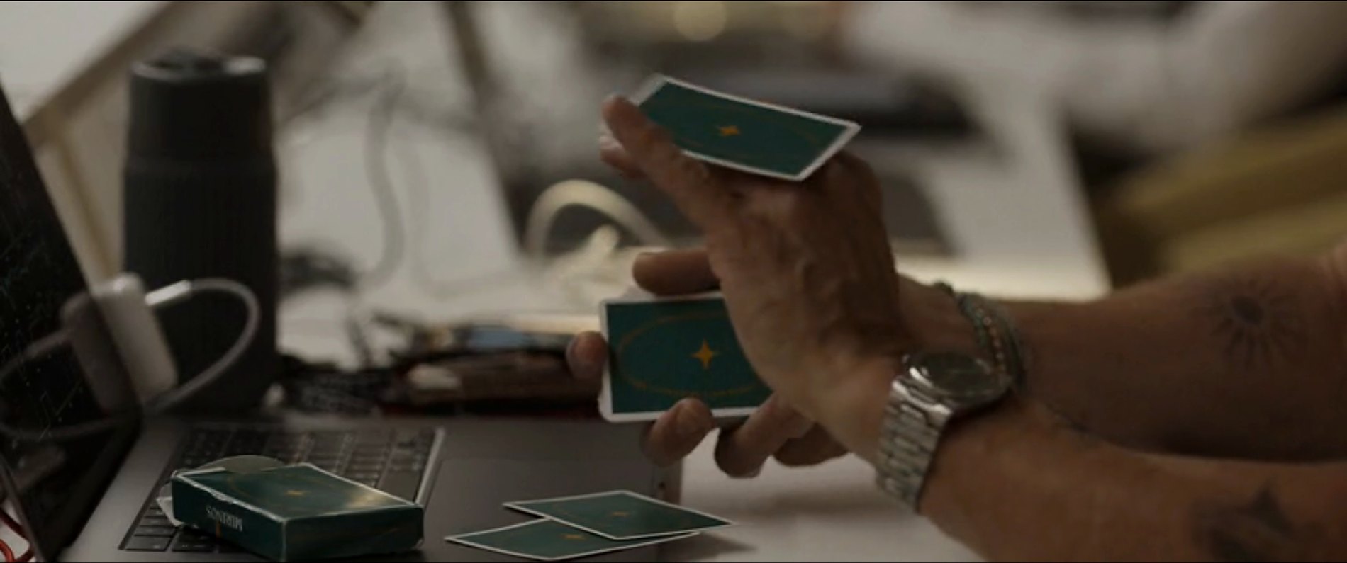 Cartelago cards handled near a desk